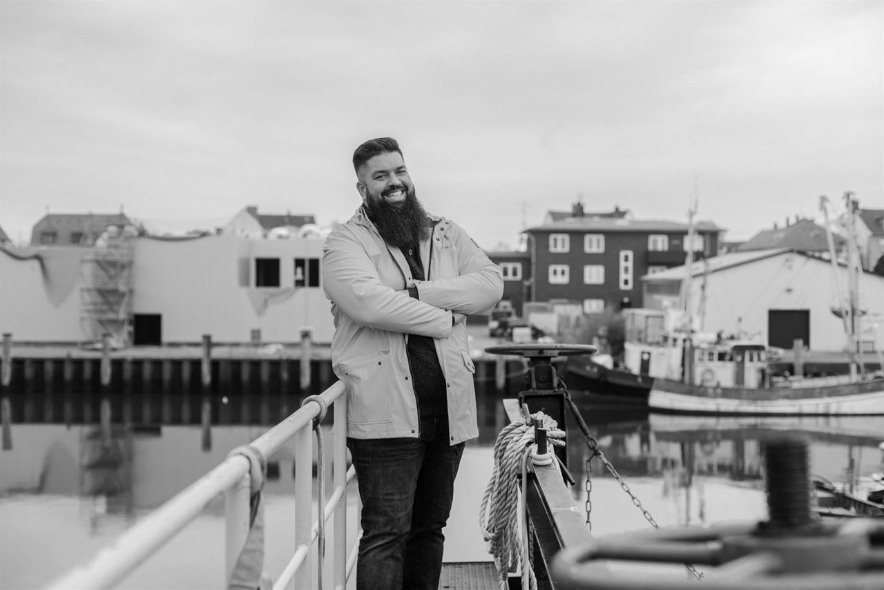 Thorsten Schwarz smiling at a harbour in Northern Germany